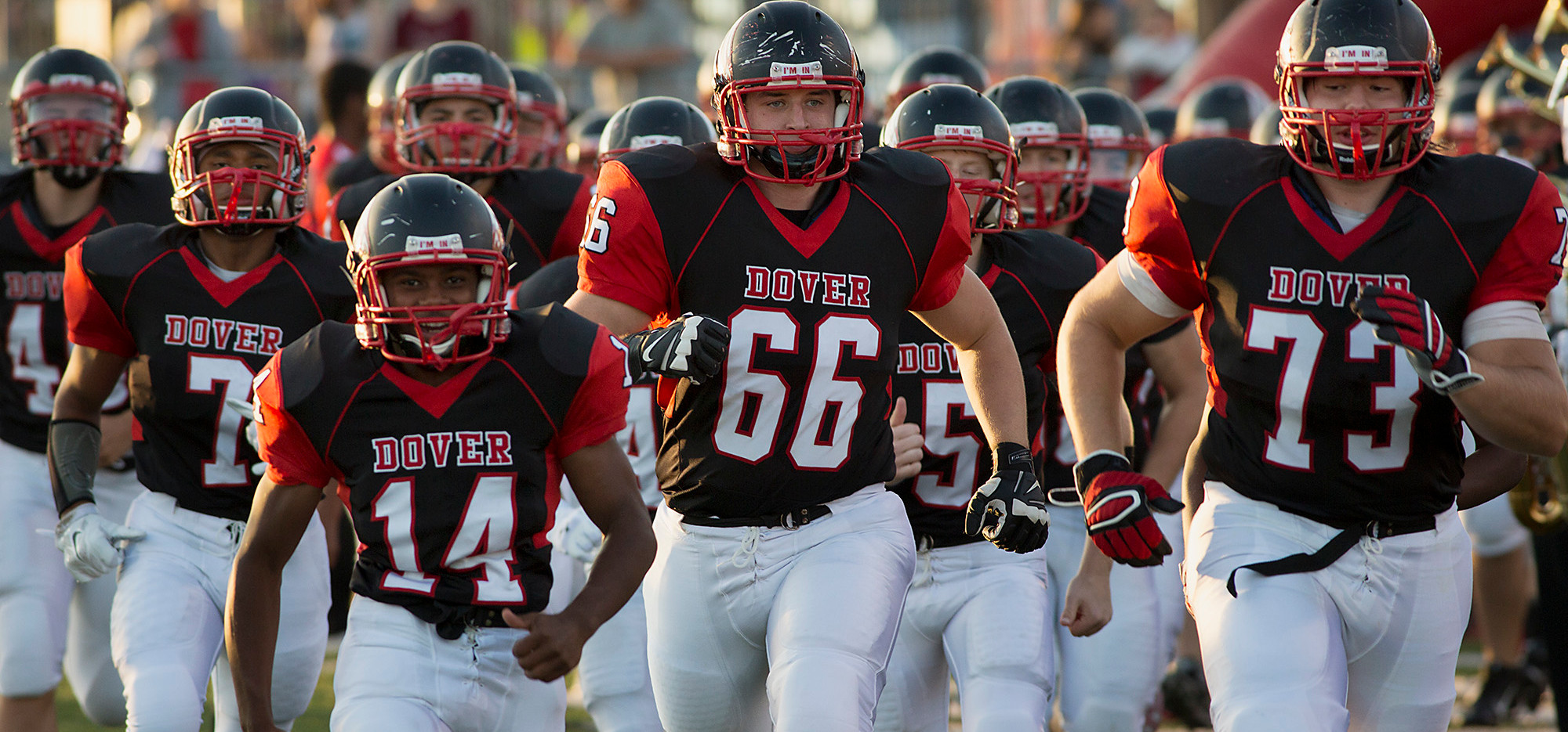 Dover's Tyrel Jones, Tyler Jacobson and Levi Murphy lead the Eagles onto the field for an early season game in 2014. The Eagles are coming off a 5-5 campaign, but have a new coach in Wayne Snelbaker with a mix of experience and promising youth. JOHN WHITEHEAD for the Daily Record/Sunday News